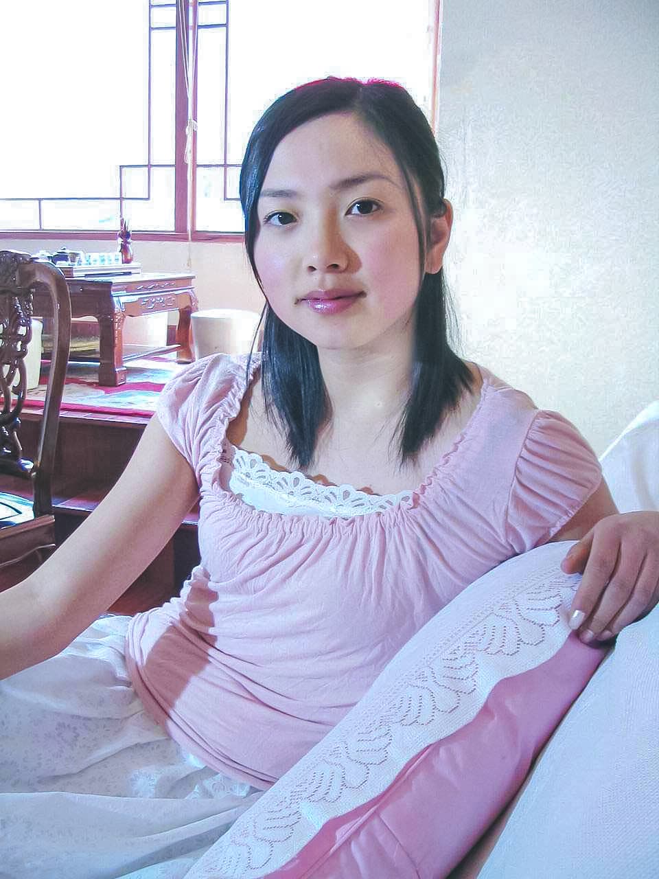 Manli's feet in slightly rumpled cotton socks fitted into sharp pointed heels, emphasizing ankle contrast